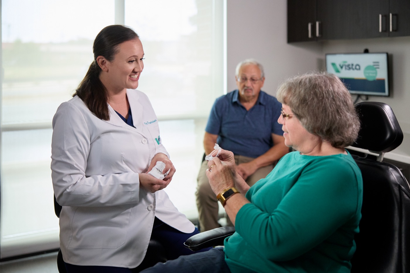 Dr. Rebecca discussing an oral appliance with a patient