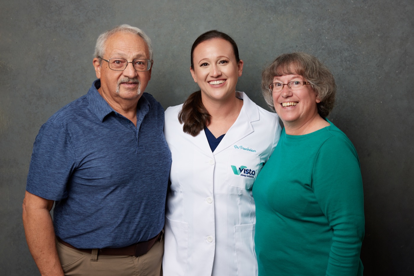 Dr. Rebecca smiling with two people at Vista
