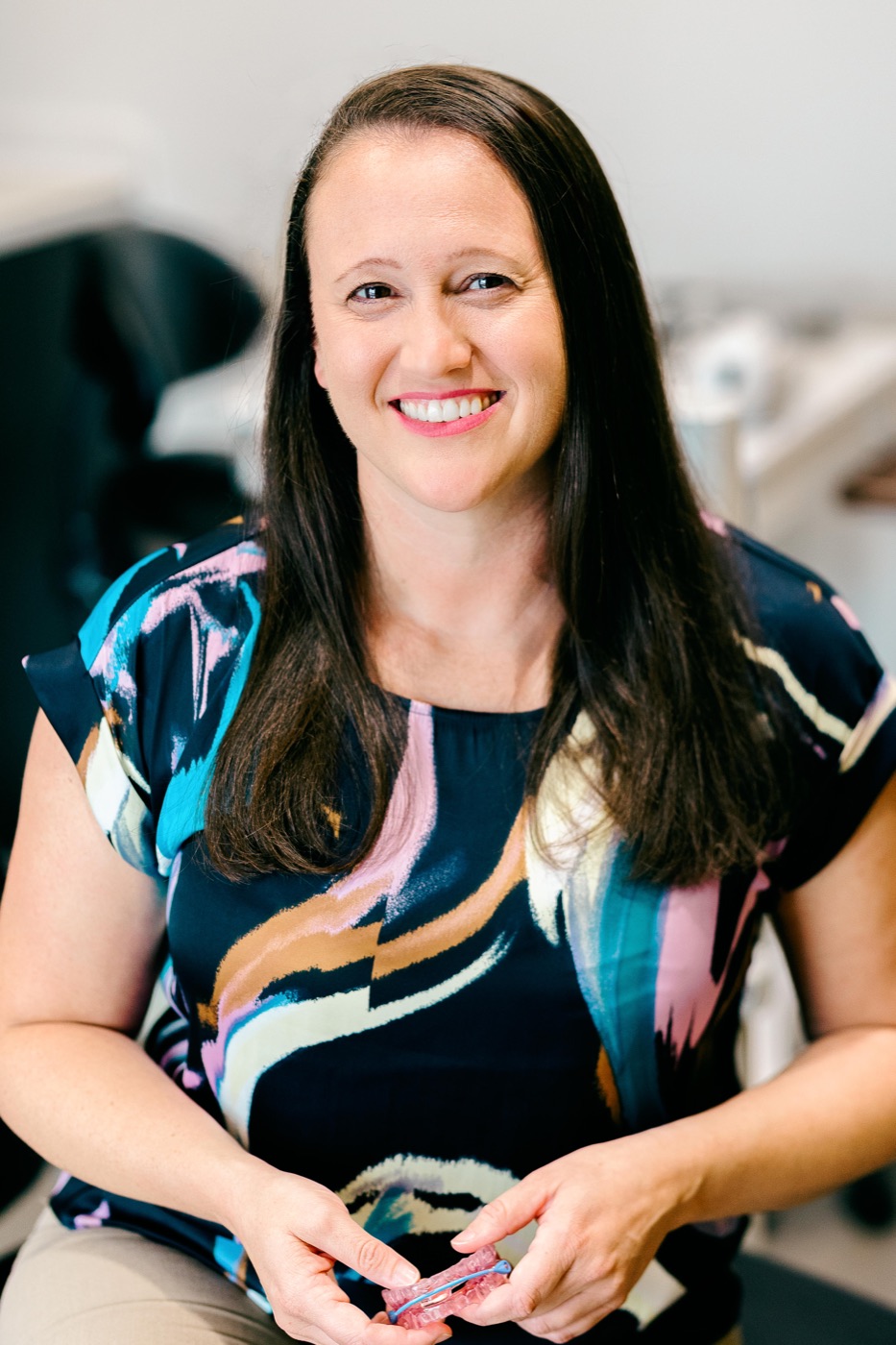 Dr. Rebecca Fronheiser smiling in her office